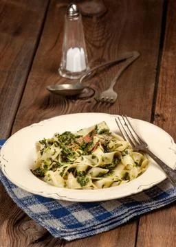 Spaghetti with spinach and bacon. Stock Photos