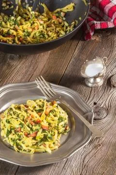 Spaghetti with spinach and bacon. Stock Photos