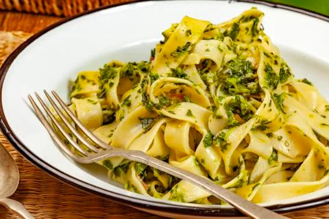 Spaghetti with spinach and bacon. Stock Photos