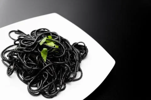 Spaghetti with squid ink Stock Photos
