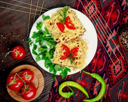 Spaghetti with stuffed meat in sauce Stock Photos