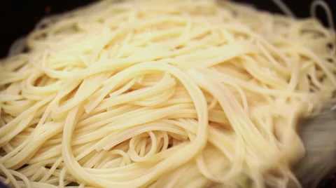 Spaghetti with tomato and vegetable sauce in frying pan Stock Footage 48657615