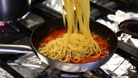 Spaghetti with tomato sauce cooking Stock Footage 106352178