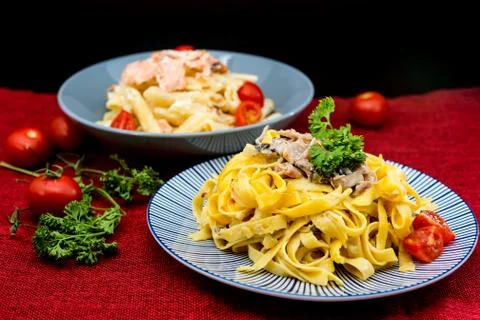 Spaghetti with tomato on a the table Stock Photos