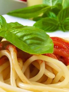 Spaghetti with tomatoes Stock Photos