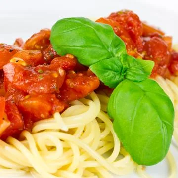 Spaghetti with tomatoes Stock Photos