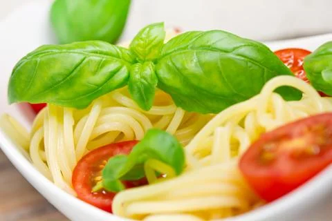 Spaghetti with tomatoes Stock Photos