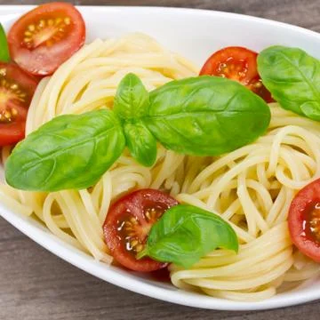 Spaghetti with tomatoes Stock Photos
