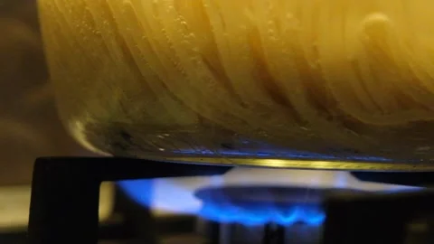 Spaghetti in a transparent pan with boiling water. Spaghetti in boiling water Stock Footage 284174443
