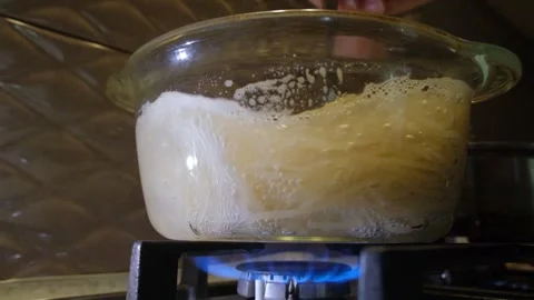 Spaghetti in a transparent pan with boiling water. Spaghetti in boiling water Stock Footage 307314317