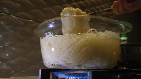 Spaghetti in a transparent pan close-up. Spaghetti in a transparent pan with Stock Footage 284941626