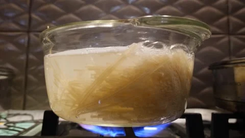 Spaghetti in a transparent pan close-up. Spaghetti in a transparent pan with Stock Footage 307314231