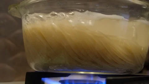 Spaghetti in a transparent pan close-up. Spaghetti in a transparent pan with Stock Footage 313754277