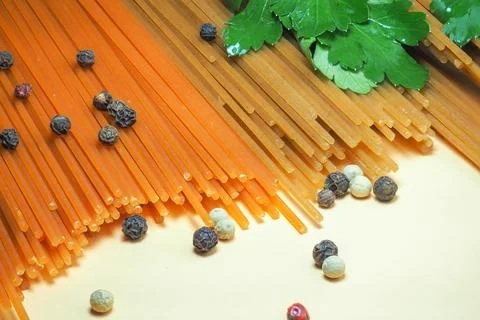 Spaghetti of two types on the table. Tomato and buckwheat pasta. Italian fo.. Stock Photos