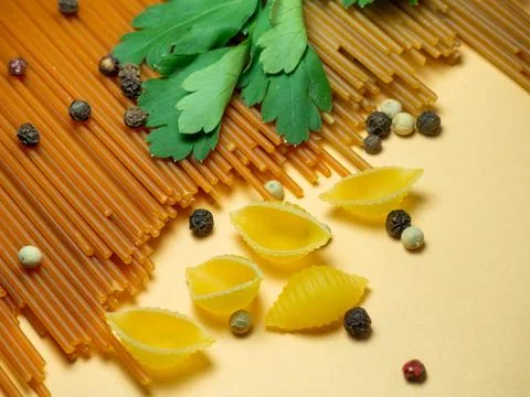 Spaghetti of two types on the table. Tomato and buckwheat pasta. Italian fo.. Stock Photos