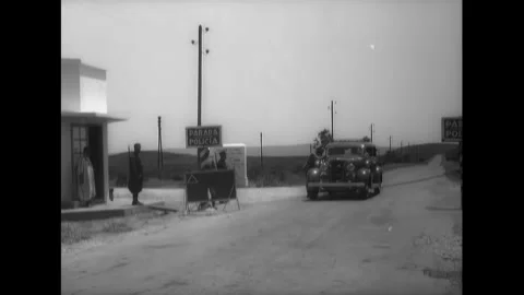 SPAIN - 1930s - Spanish border control officers inspect a car before letting Stock Footage 340571526
