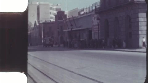 Spain 1950s, long queue outside Petter Motor Oil building in Barcelona Stock Footage 317538124