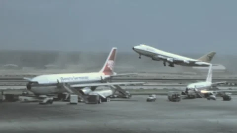 Spain - 1977: Jumbo Jet Boeing 747 takes off in an airport runway Stock Footage 186444795