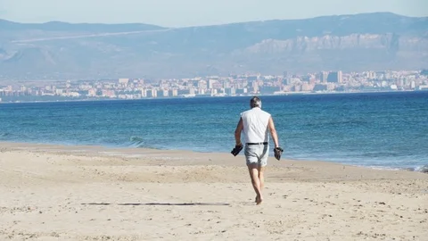 Spain beach old man walking Stock Footage 89700097