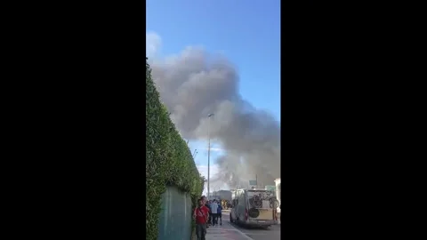 Spain: Fire Guts Restaurant in La Manga, Sending Smoke Across Coastline Stock Footage 334829388
