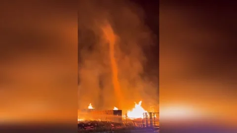 Spain: Fire Tornado Engulfs Industrial Blaze In Spain Night Inferno Stock Footage 333603717