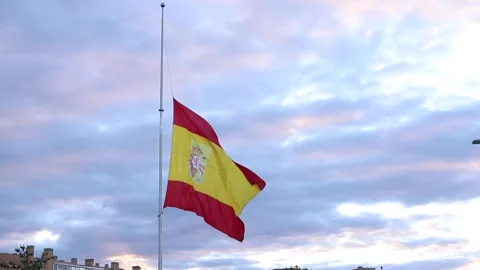Spain flag honoring half up Stock Footage 130903107