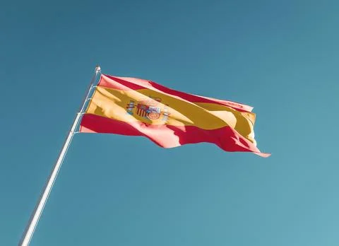 Spain flag low angle on sky background Stock Photos