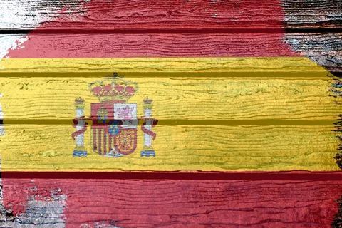 Spain flag - realistic looking flag on a wooden surface Illustrazione stock