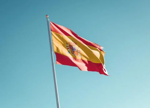 Spain flag on sky background Stock Photos