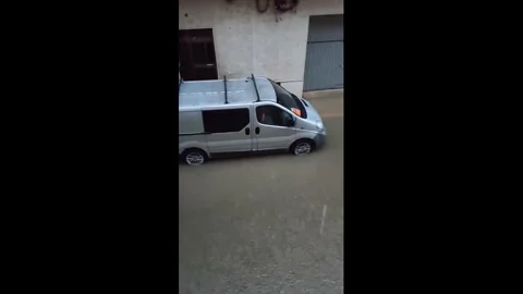 Spain: Heavy downpours and flooding affects in Carcaixent, Spain Stock Footage 325466372