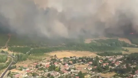 Spain: Helicopters Circle Massive Wildfire As Hundreds Evacuate In Spain Stock Footage 340937077