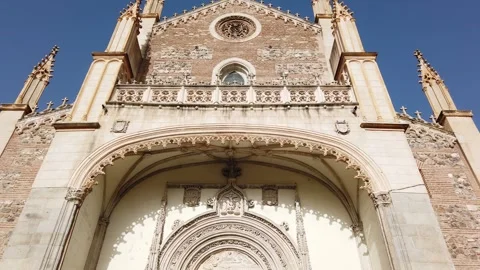 Spain Madrid Low Angle Tilt Up of Gothic Facade Church Entrance San Jeronimo el Stock Footage 338684426