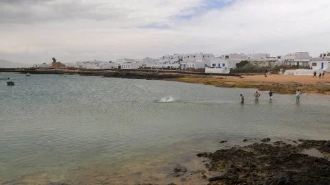 SPAIN - MAY 5, 2018: People enjoying a day at the beach in the only inhabited Stock Footage 89707024