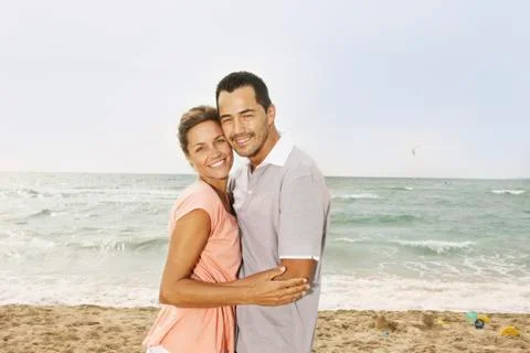 Spain, Mid adult couple on beach at Palma de Mallorca, smiling Stock Photos
