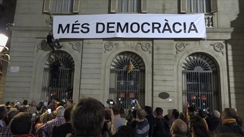 Spain Oct 2017 - Nationalist protester falls tearing down a Democracy banner Stock Footage