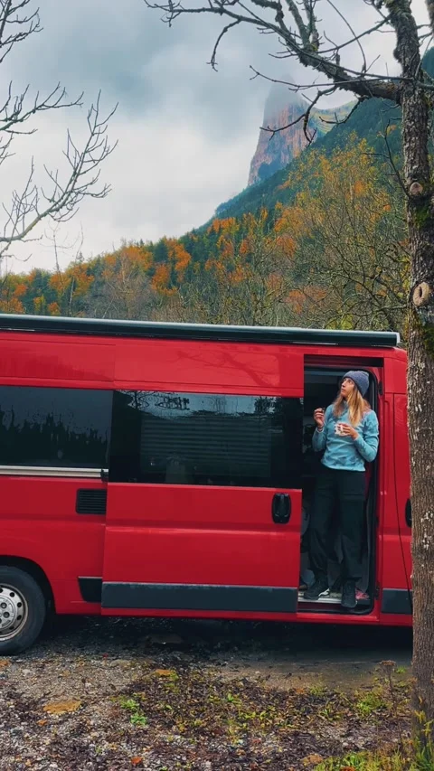 Spain Ordesa y Monte Perdido, Woman with Red Van Enjoying Autumn Breakfast Stock Footage 317550683