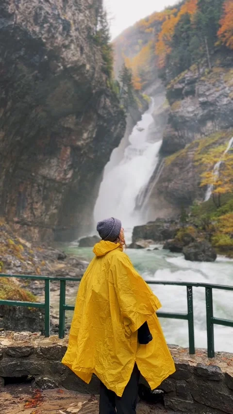 Spain Ordesa y Monte Perdido, Woman Admiring Autumn Waterfall Vertical Video Stock Footage 317550710