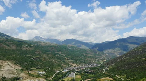 Spain Pyrenees town of Sort below big cloud Stock Footage 62730713