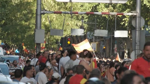 Spain supporters wave flags under traffic signs during the 2026 FIFA World Cup Stock Footage 340924555