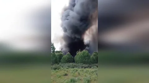 Spain: Tornado Smoke Column Rises Over Recycling Plant Fire In Almonte Stock Footage 333218348