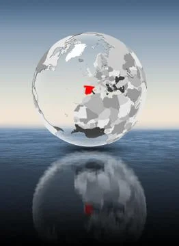 Spain on translucent globe above water Stock Illustration