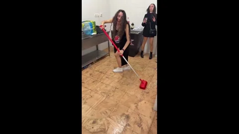 Spain: Woman slips while mopping in Malaga, Spain Stock Footage 326133581