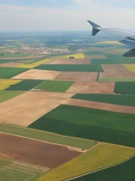 Spainish meadows as seen through window of an airplane Stock Photos