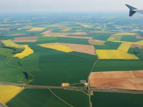 Spainish meadows as seen through window of an airplane Stock Photos