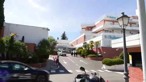 Spain's King Felipe VI visits Queen Sofia at the clinic where she is recovering  Stock Footage 271574435