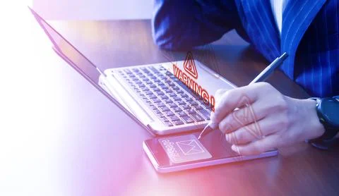 Spam email on screen warns of data theft by hackers Stock Photos