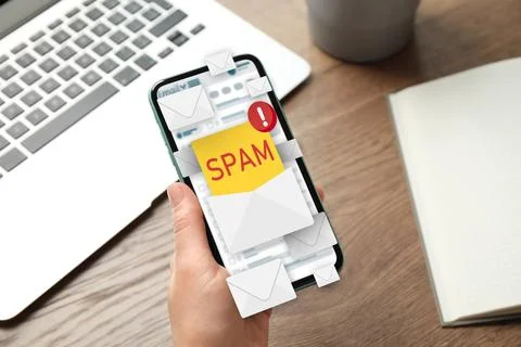 Spam warning message, envelope illustrations popping out of device display... Stock Photos