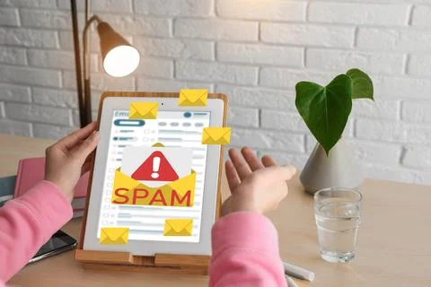 Spam warning message, envelope illustrations popping out of device display... Stock Photos