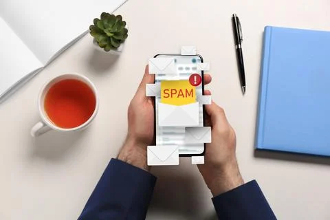 Spam warning message, envelope illustrations popping out of device display... Stock Photos