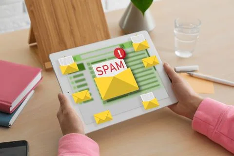 Spam warning message, envelope illustrations popping out of device display... Stock Photos